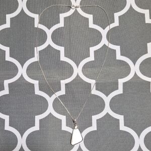 Mother-of-pearl or abalone shell pendant with sterling silver chain